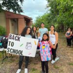 Annual Back-to-School Supply Drive - Ariela Tejada and Student with Backpack