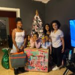 Annual Holiday Toy Drive - Daniela and Ariela Delivering Barbie Dreamhouse to Family