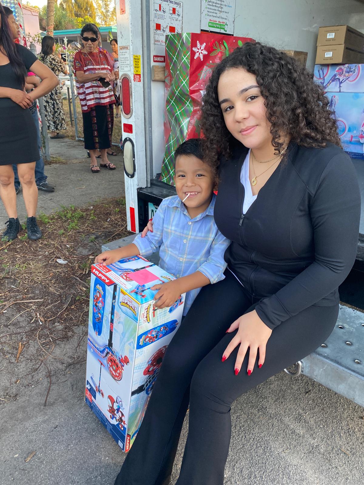 Ariela Tejada on tailgate with Spidey scooter